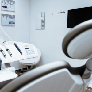 Bright dental office showcasing modern equipment and clean, sleek design.